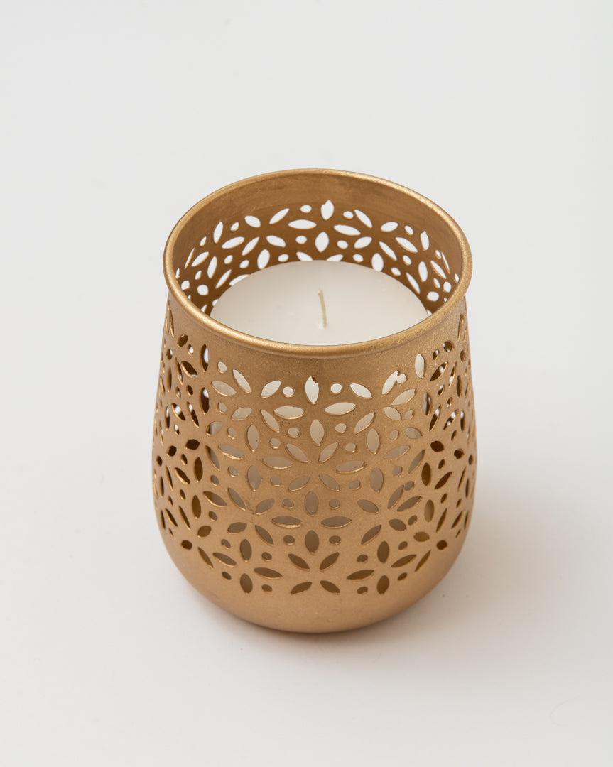 The dye-cut old gold votive adds an elegant touch to the dinner table decor.